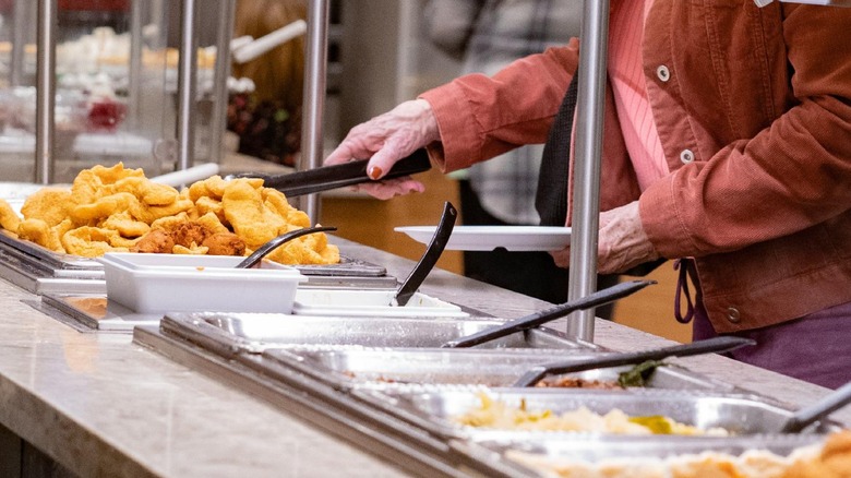 customer filling plate from buffet