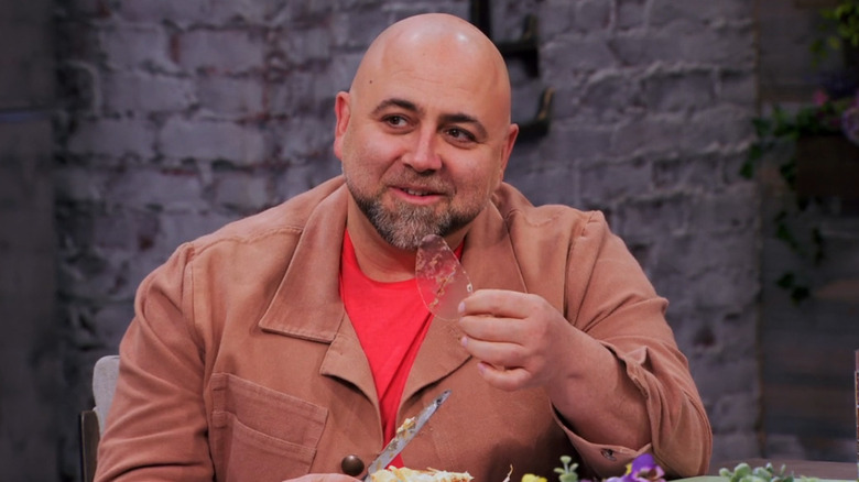 Duff Goldman holds an egg mold