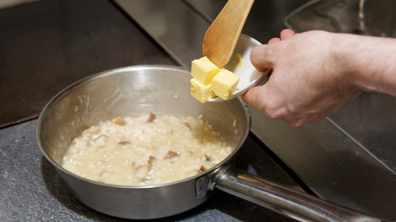 adding butter to risotto 