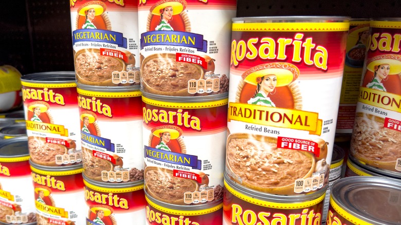 cans of refried beans on shelf