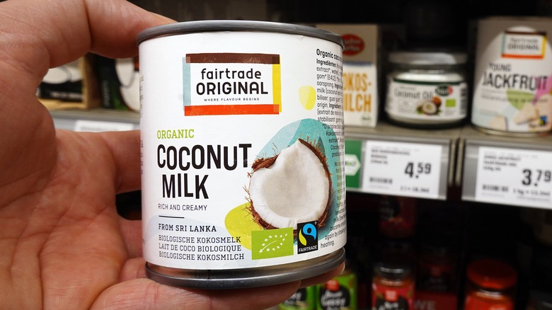 holding can of coconut milk