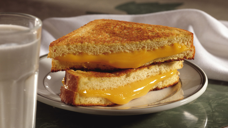 Triangular sliced grilled cheese sandwich