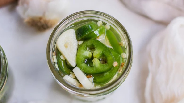 Pickled jalapeños in jar