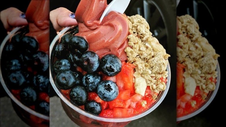 hand holding acai bowl