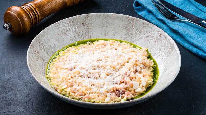 Risotto in a gray dish with a knife and fork