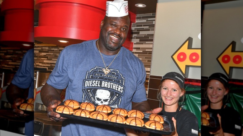 Shaquille O'Neal holding Krispy Kreme doughnuts tray