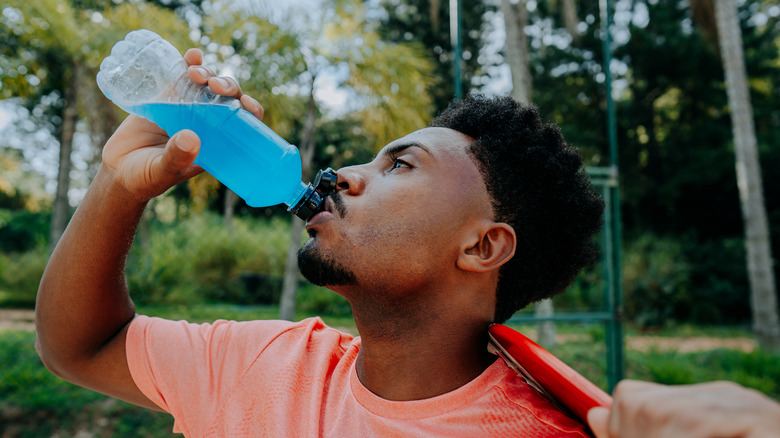 Man with blue sports drink