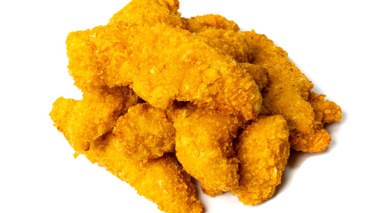 Pile of crispy breaded chicken strips