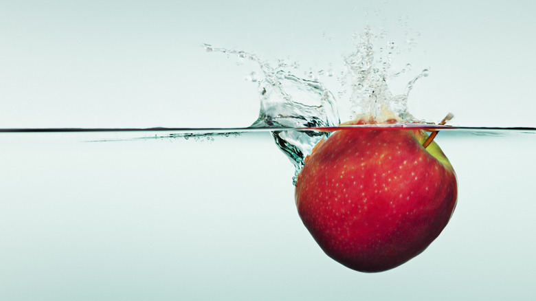 red apple bobbing in water