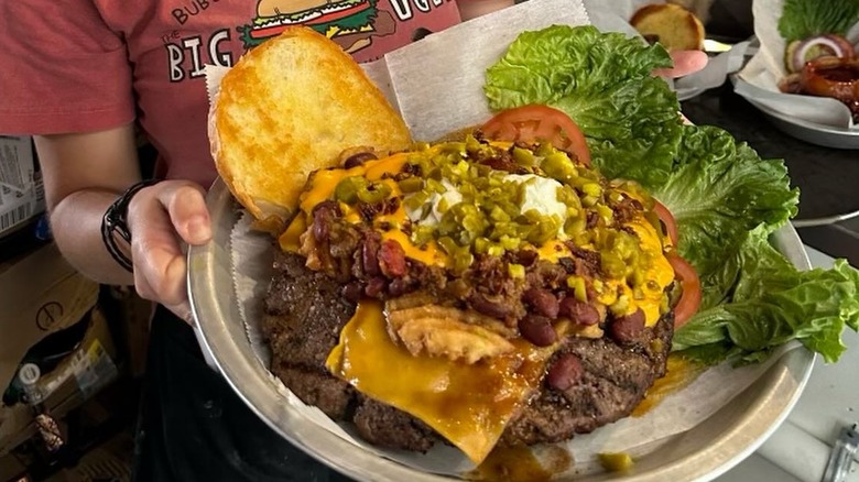 enormous burger on plate