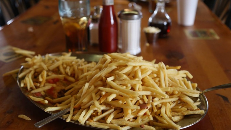 burrito buried underneath french fries