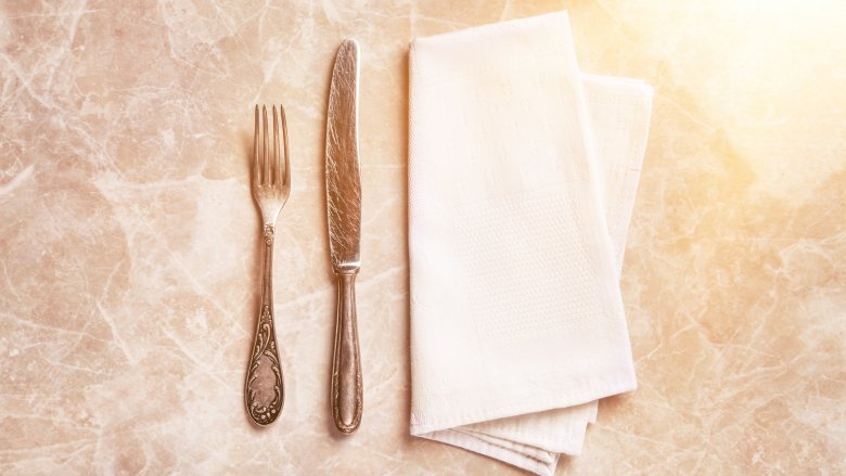 Silverware and napkin on table