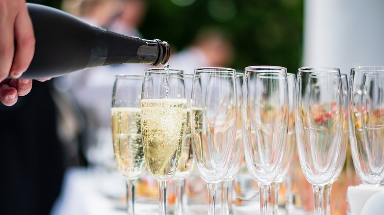 pouring glass of sparkling wine