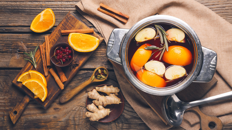 pot of cider with mulling spices