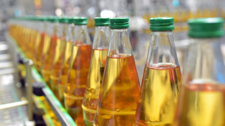 assembly line bottles of apple juice