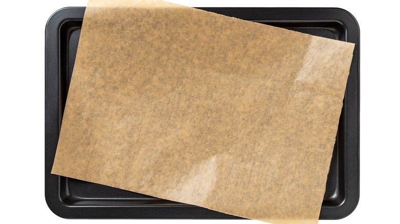 dark baking sheet with parchment paper