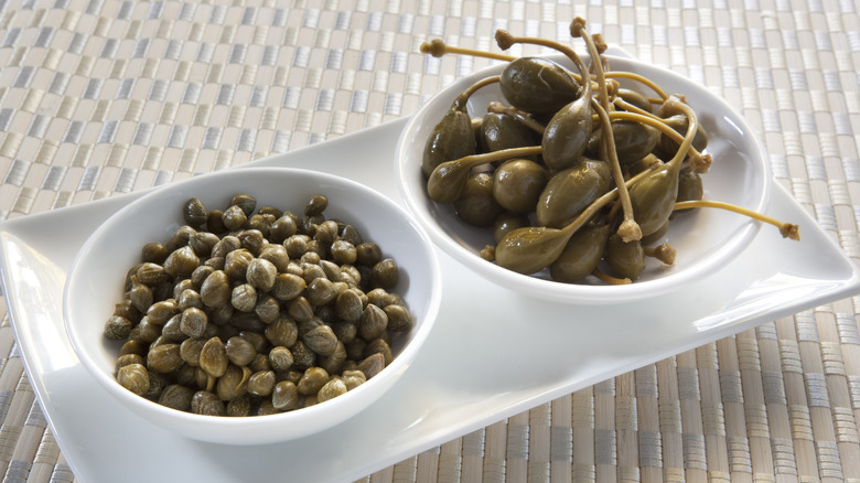 white bowls capers and caperberries