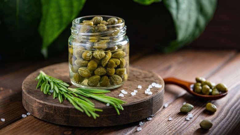 jar of capers cutting board