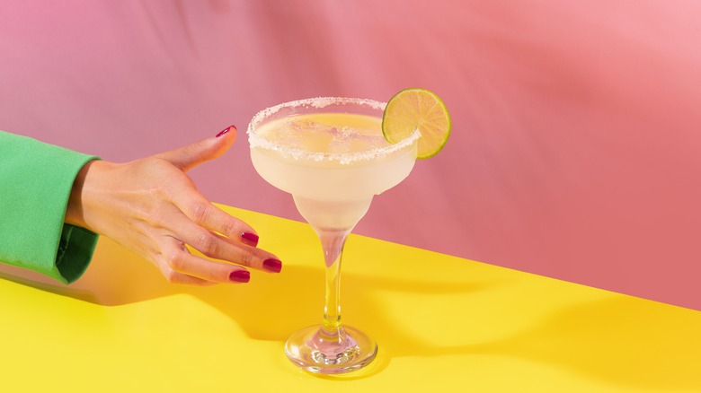 Woman drinking a margarita