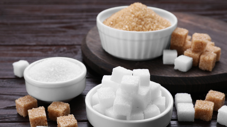 Various types of sugar in white ramekins