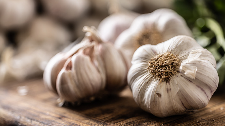 Bulbs of garlic on wooden table