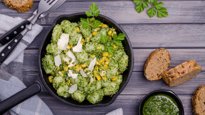 gnocchi tossed with sauce in pan