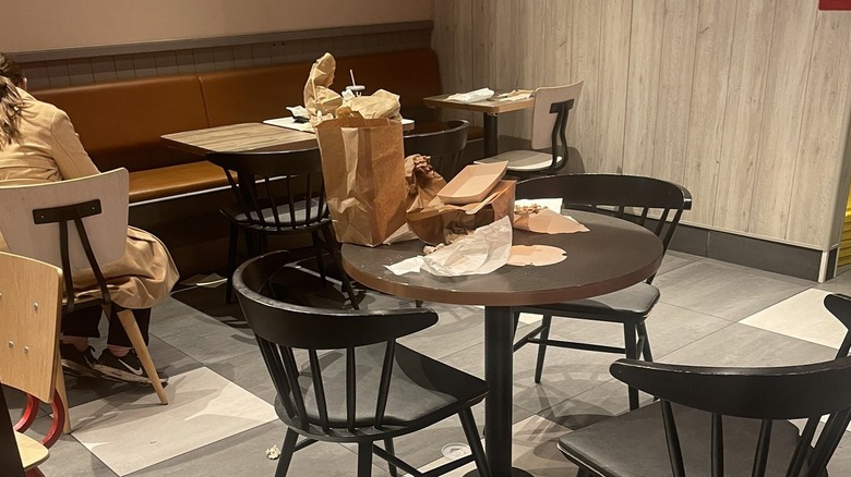 Restaurant dining room with excessive trash