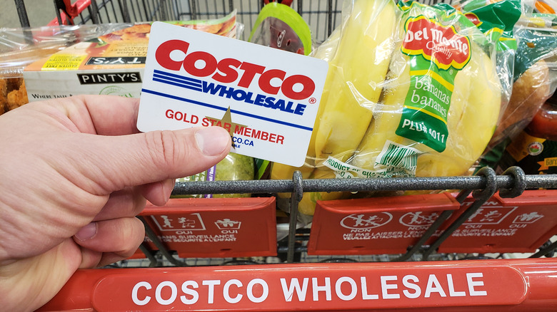 hand holding costco membership card