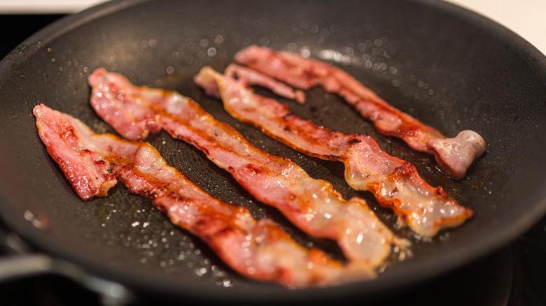 bacon frying in pan