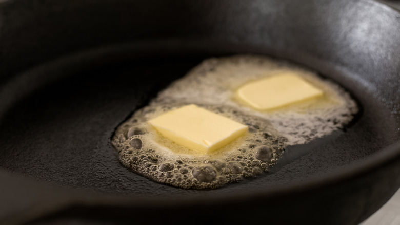 butter melting in frying pan