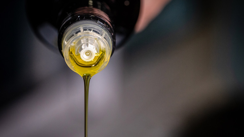 olive oil poured from bottle