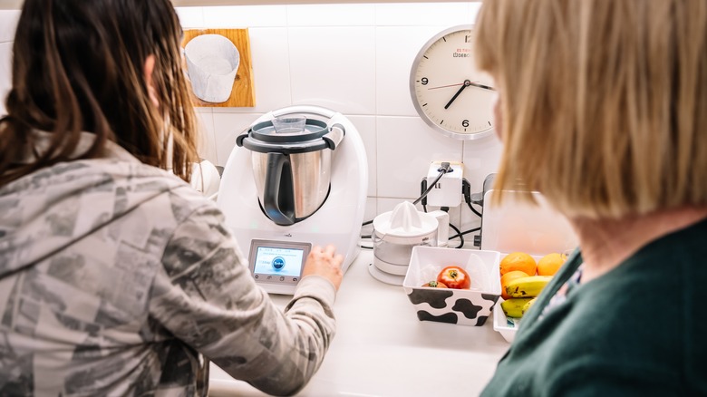 Two women using Thermomix