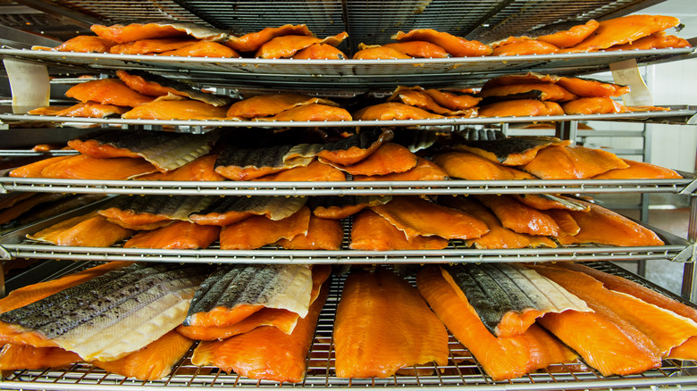 racks full of hot smoked salmon