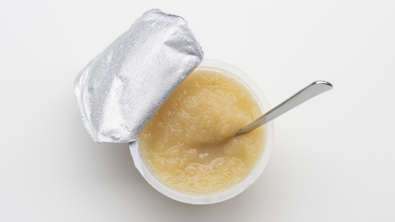 applesauce in cup with spoon