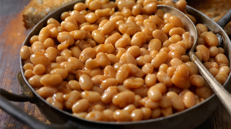 beans in pan with spoon