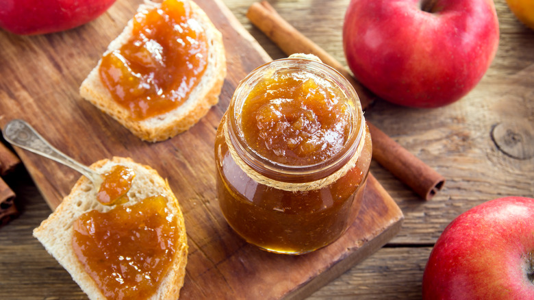 Apple butter in jar and spread on bread