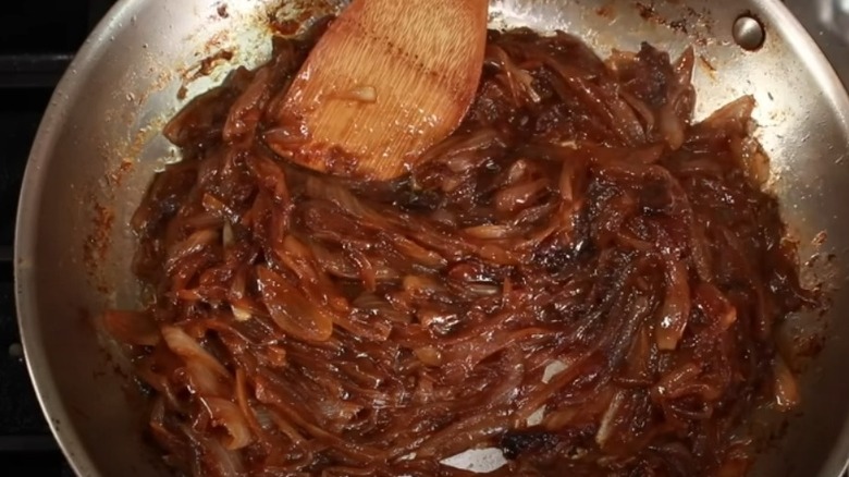 stirring caramelized onions in pan