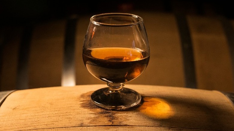 glass of brandy on a barrel