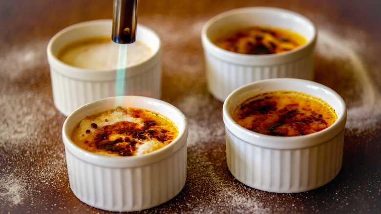 four ramekins of crème brûlée