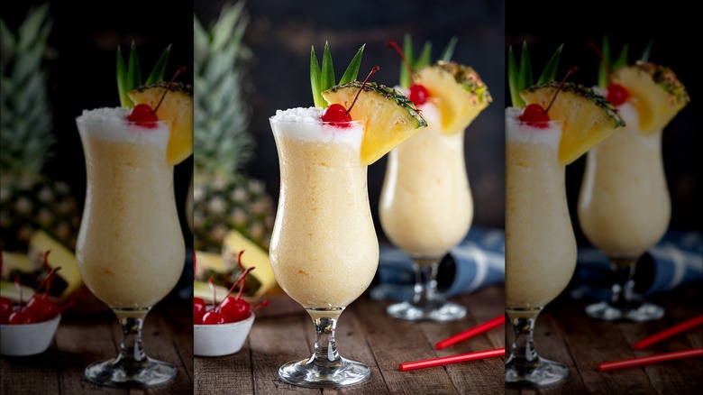 piña coladas with fruit garnish