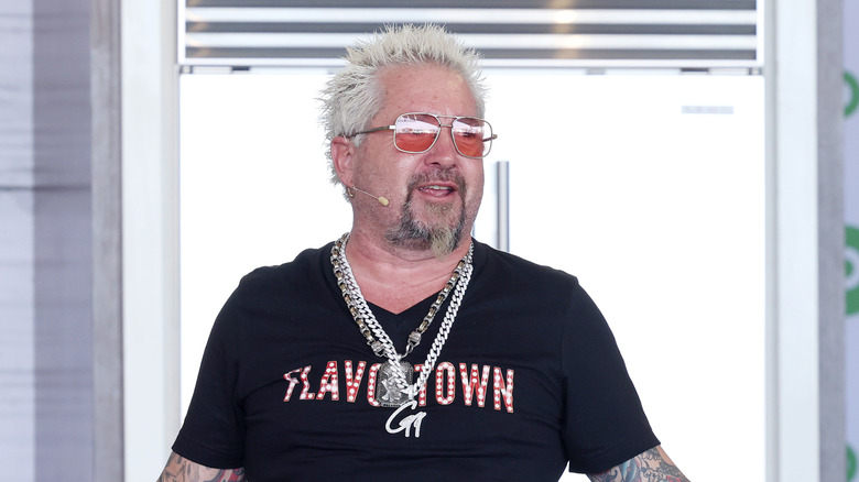 Guy Fieri speaks at event in Flavortown T-shirt