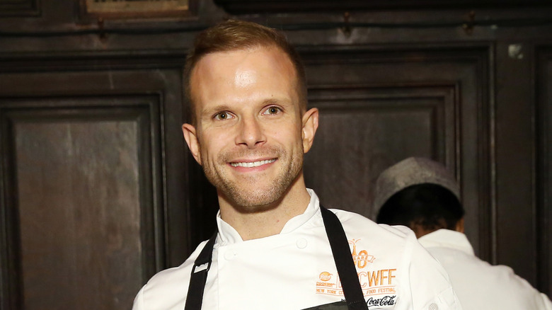 Chef Zac Young smiling while baking