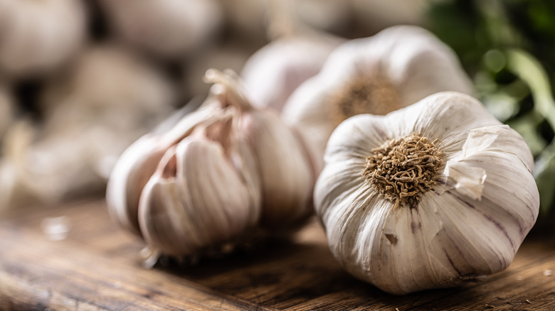 Garlic bulbs on cutting board