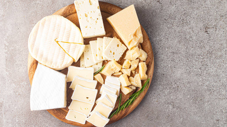 Selection of cheeses on board