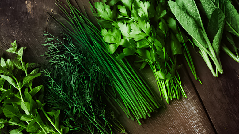 Fresh herbs on wooden table