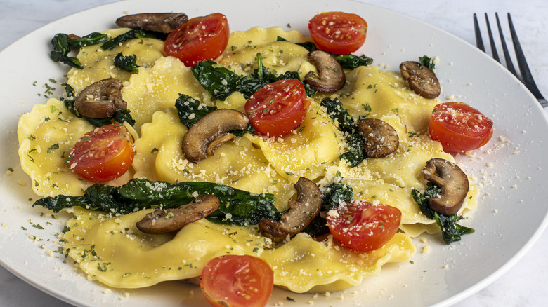 ravioli with mushrooms and spinach and cherry tomatoes