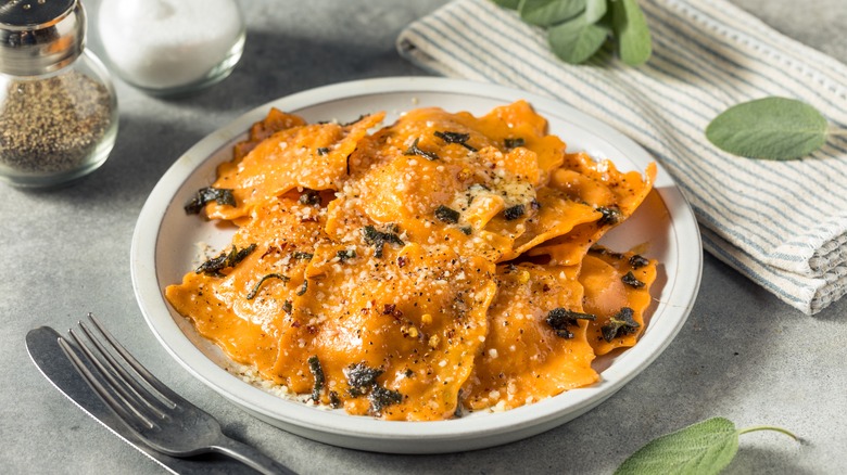 ravioli with creamy sauce and Parmesan cheese