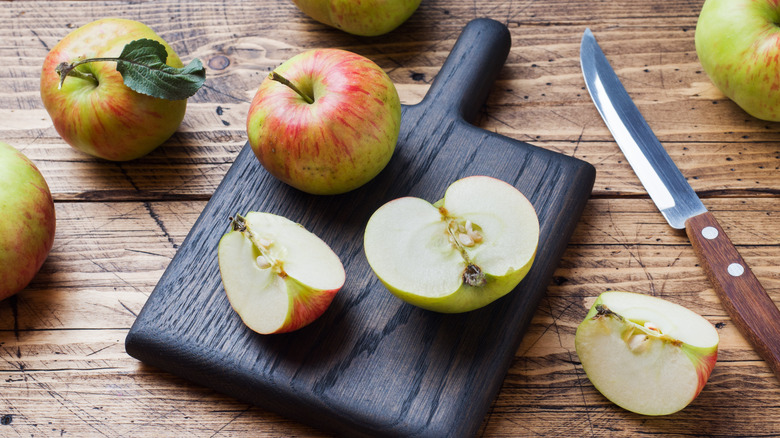 chopping apples on cutting board