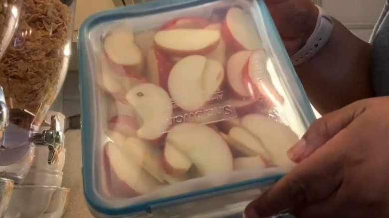 sliced apples in plastic storage box