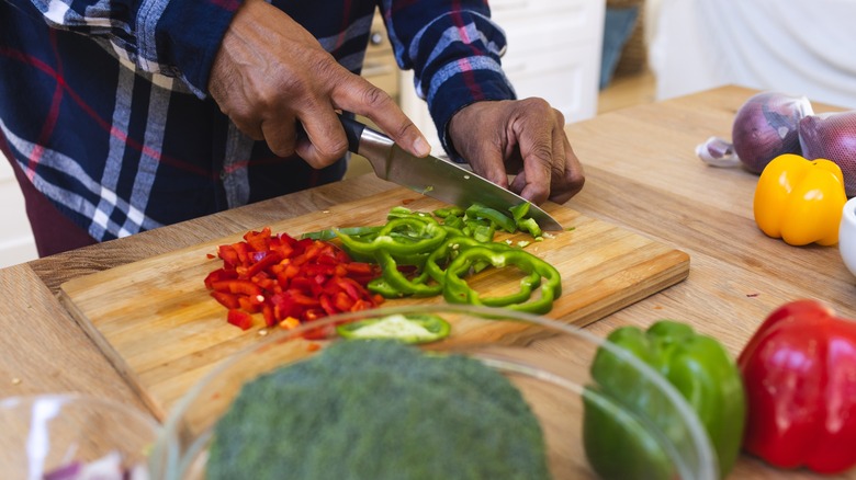 person chopping veggies